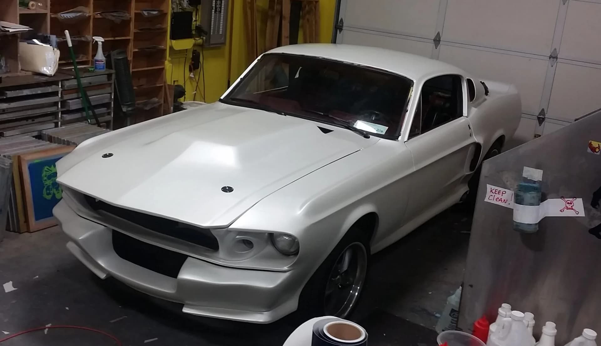Ford Mustang Fastback in satin white inside the Oly Wraps shop in Olympia, WA